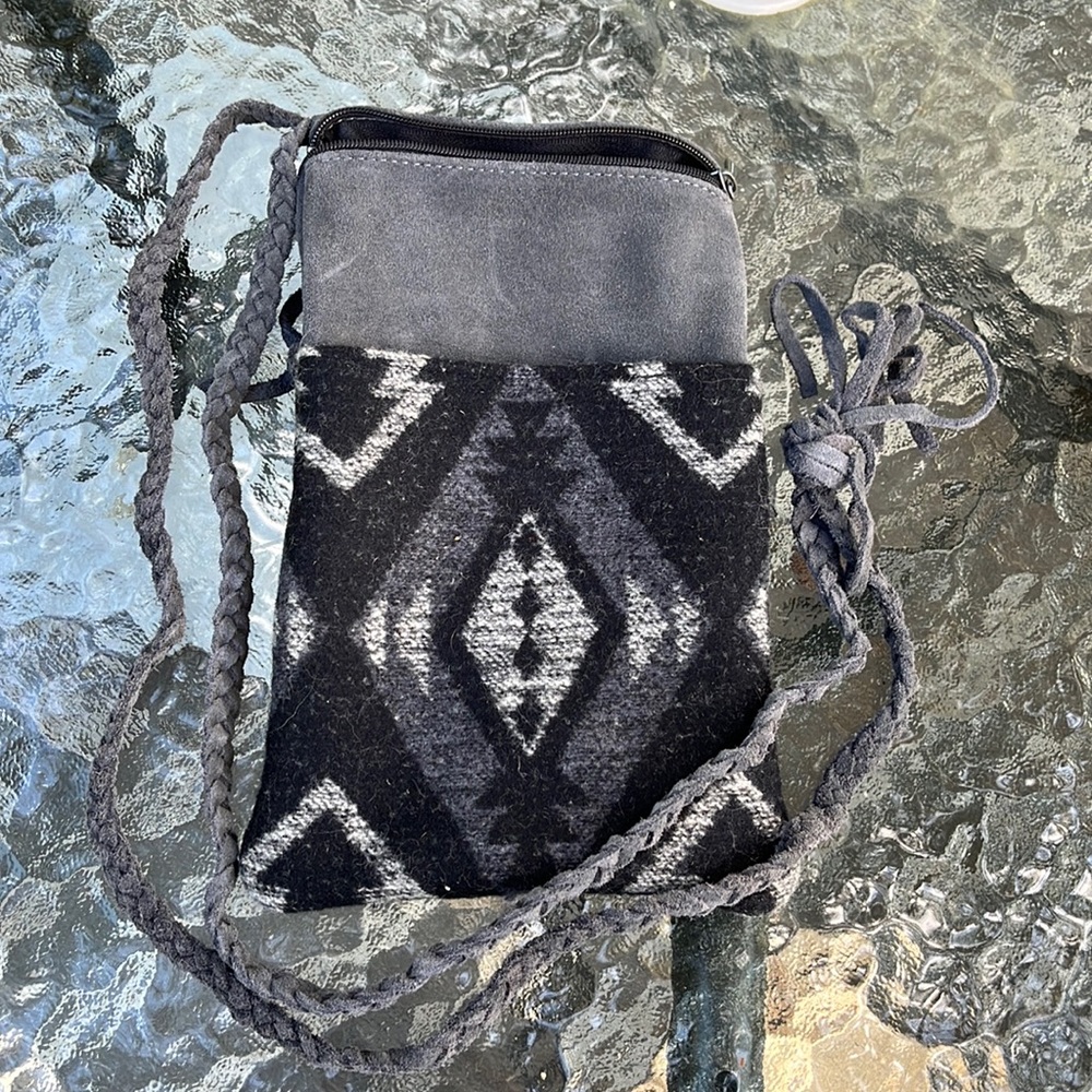 Never used genuine leather Manitobah Mukluks crossbody mini purse/phone purse